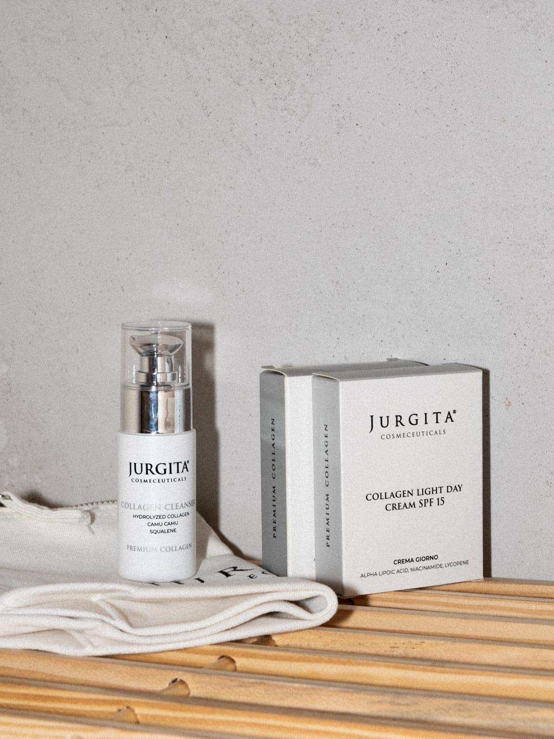 Jurgita Cosmeceuticals Collagen Cleanser, Collagen Rich Serum, and Collagen Day Cream SPF 15, elegantly displayed on a wooden surface for a premium skincare experience.