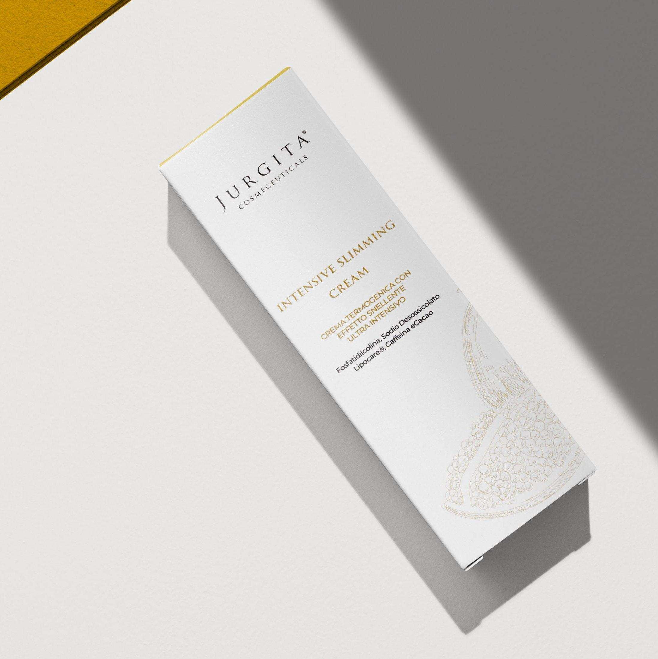 A Jurgita Intensive Slimming Cream box placed on a neutral-colored surface with soft shadows, emphasizing its premium packaging design.