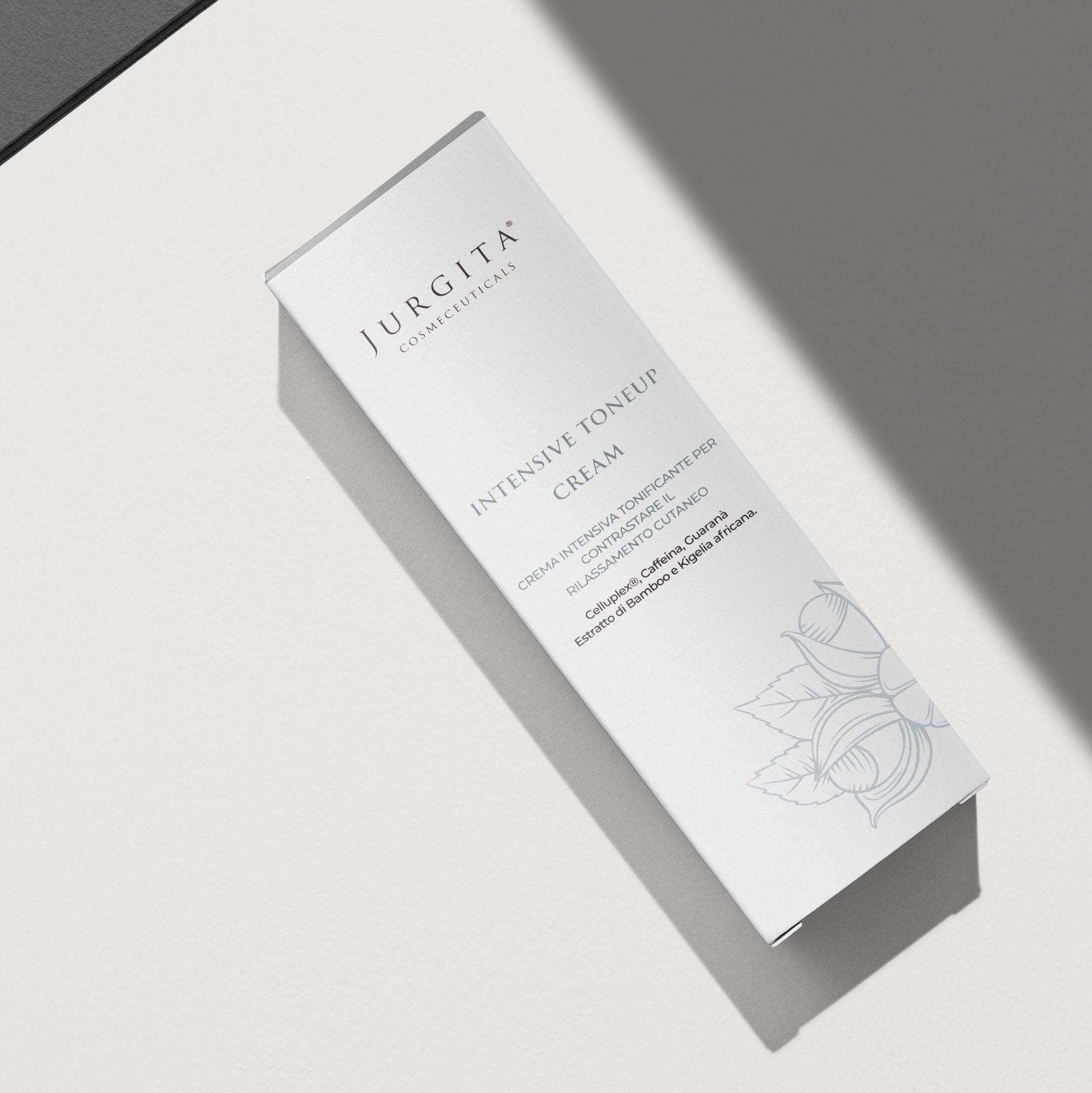Jurgita Cosmeceuticals Intensive Tone Up Cream packaging displayed on a textured surface, highlighting its premium botanical skincare formulation.