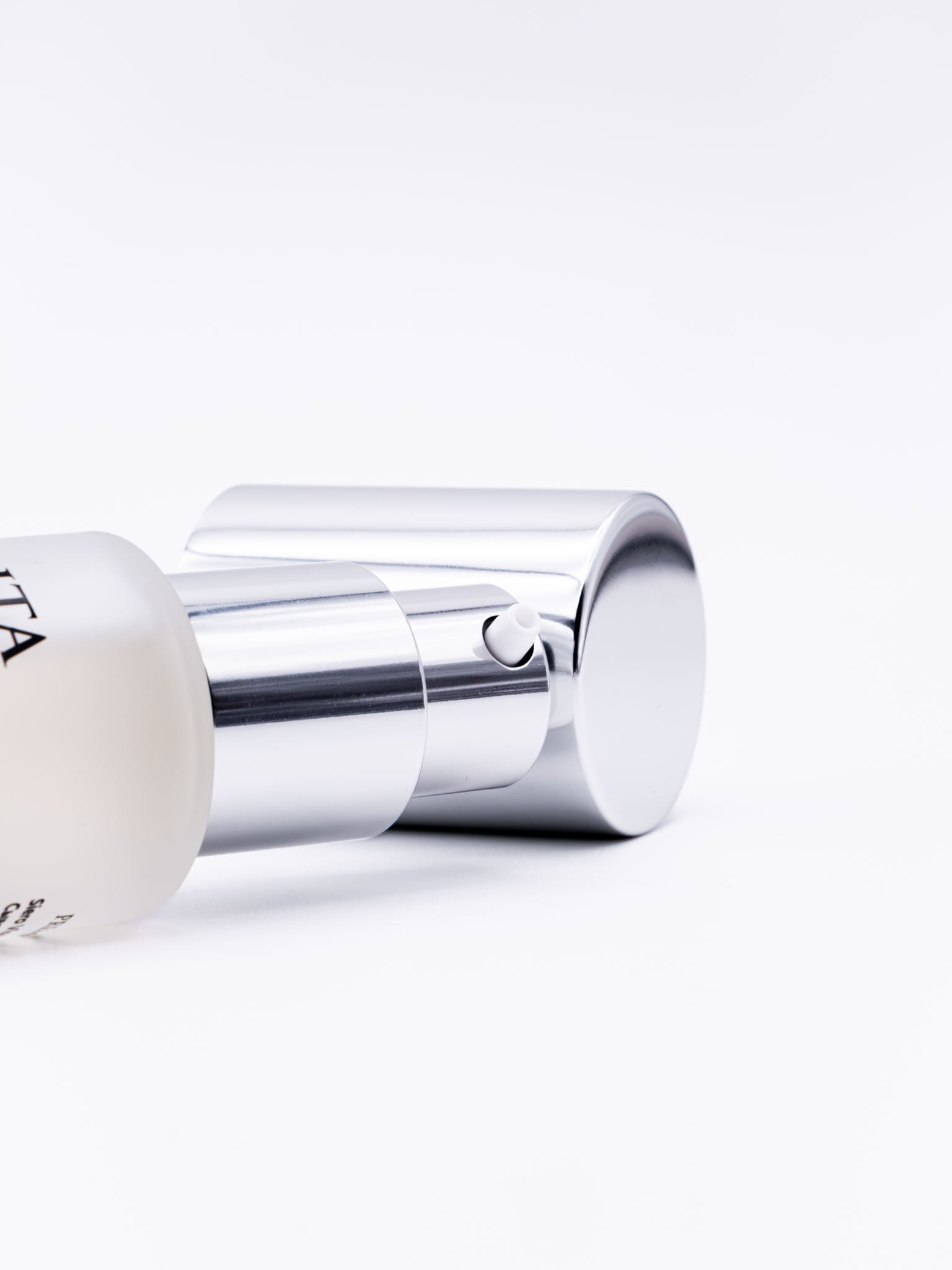 A sleek, transparent bottle of "Collagen Rich Serum" with a silver pump, labeled with key ingredients and branding.