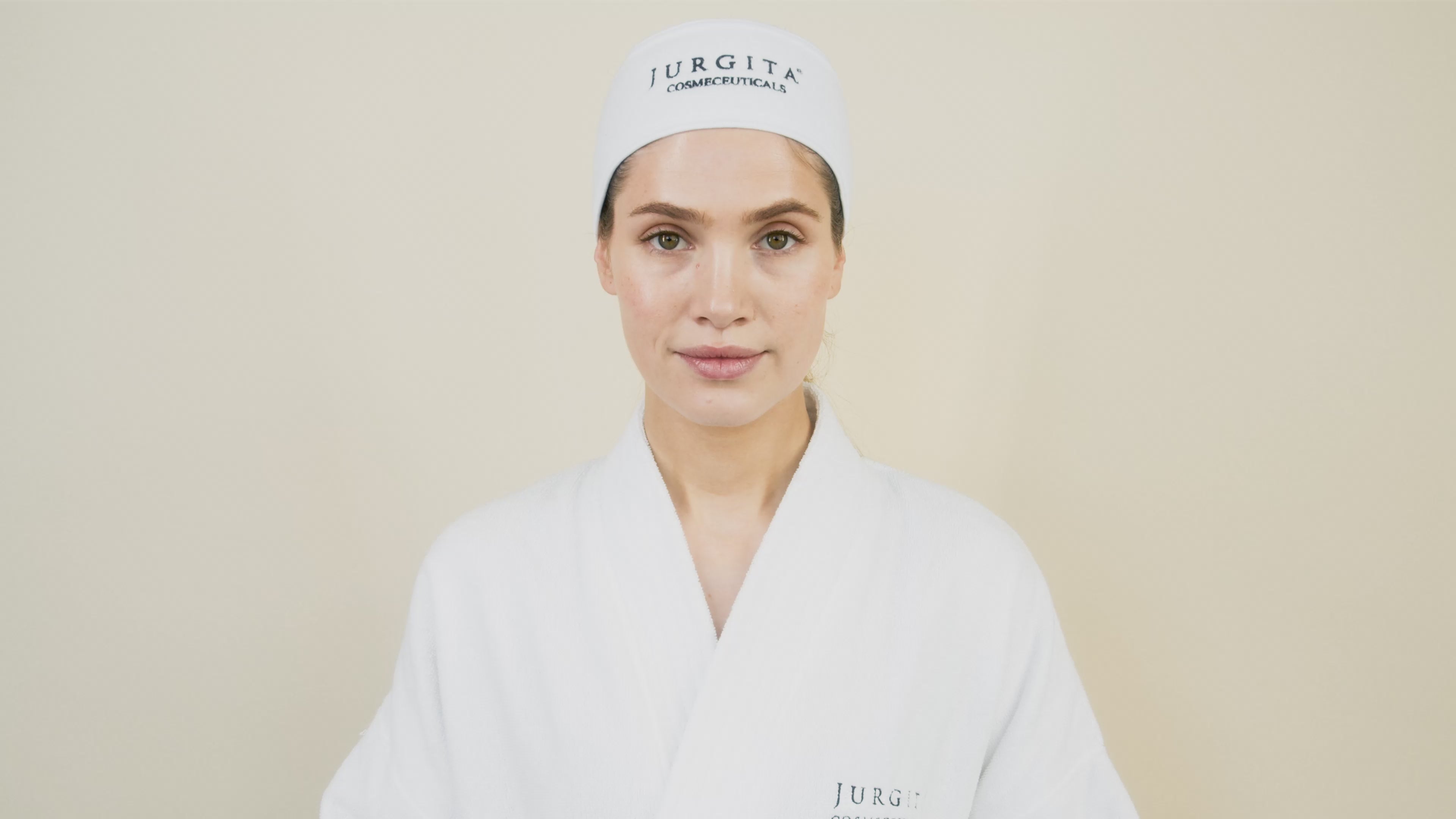 A model applies Repair Collagen Night Cream to her skin, demonstrating its smooth texture and deep hydration benefits as part of a nighttime skincare routine.