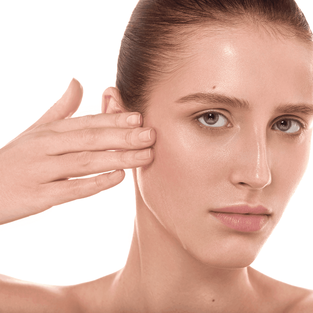 A close-up of a model applying the serum to her cheek, showcasing its lightweight and smooth texture.