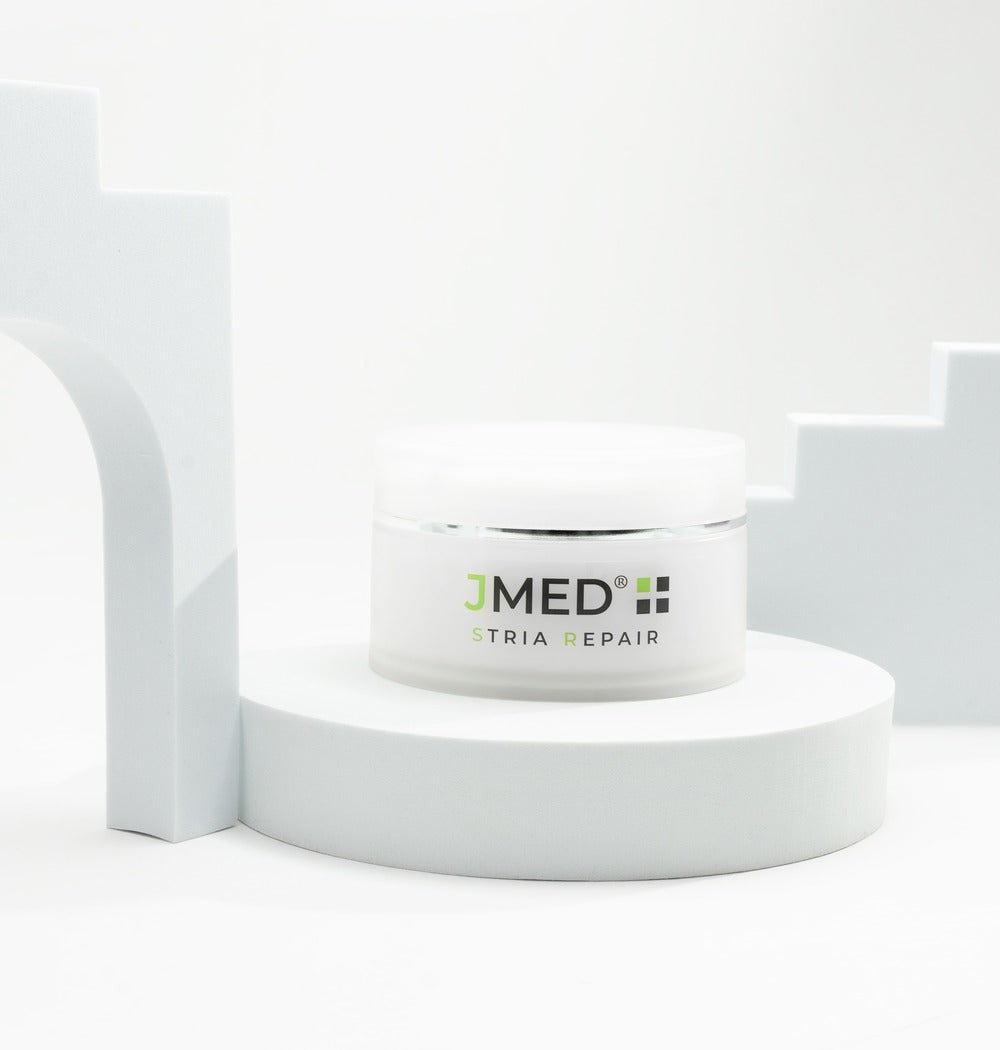JMed Stria Repair Enzymatic Body Scrub – alternate setting showcasing premium packaging and exfoliating skincare formula.