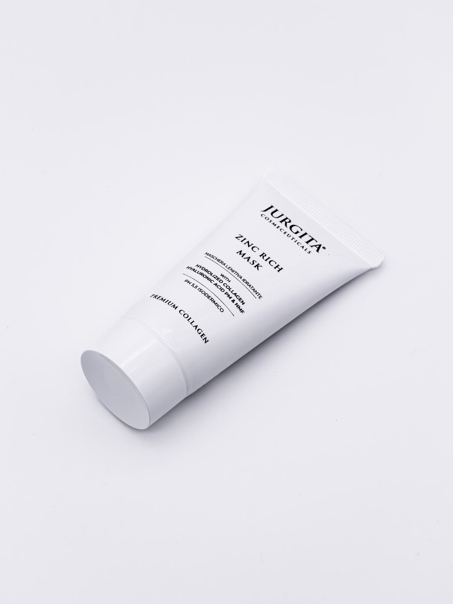 Jurgita Zinc Rich Mask tube placed on a modern white background emphasizing luxury skincare aesthetics.